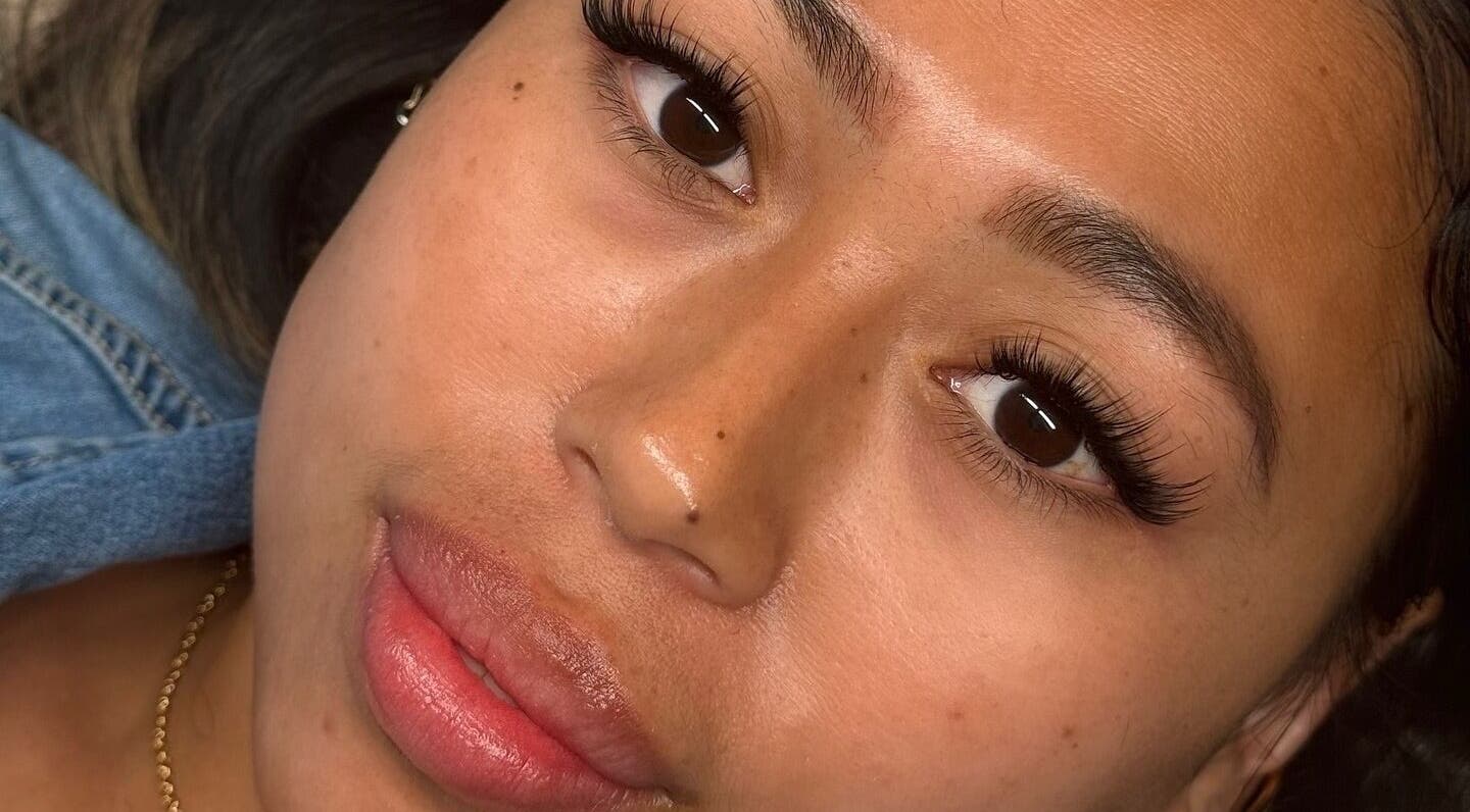 Close-up of woman's face with elegant lashes at AJade Cosmetics, Birmingham, England, GB.