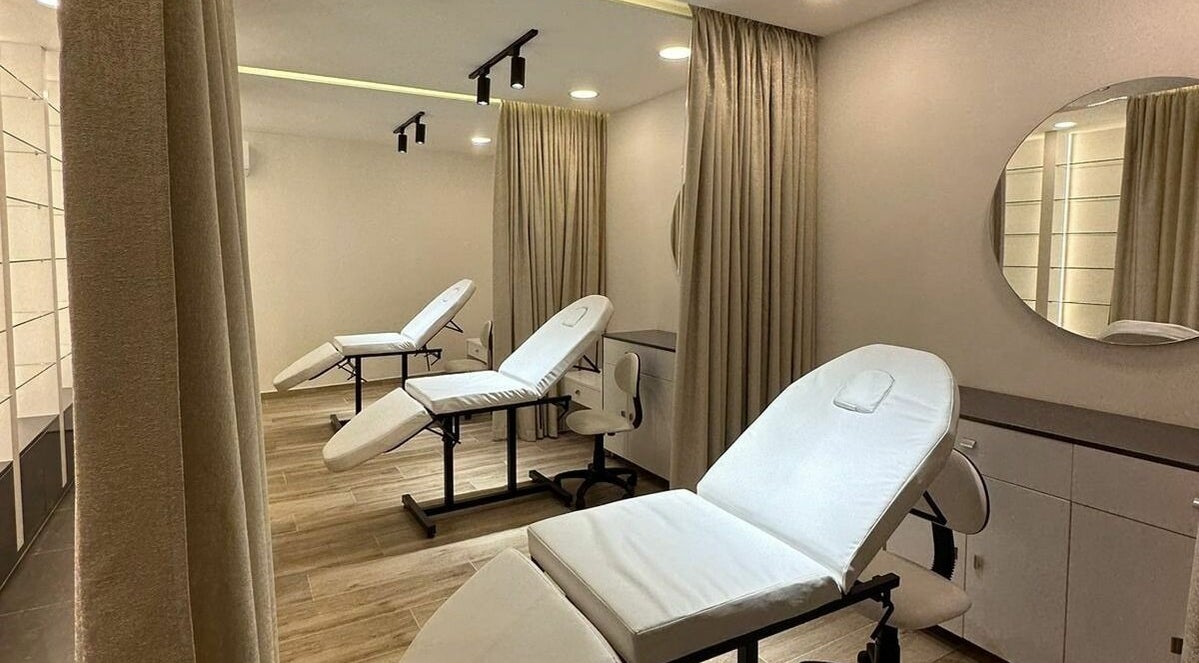 Modern treatment room at Maya Sawaya Beauty Lounge, Jal El Dib, LB, featuring sleek white chairs and soft lighting.