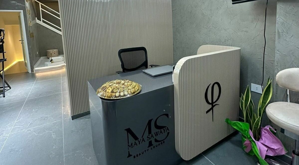 Reception area at Maya Sawaya Beauty Lounge, Jal El Dib, LB, featuring sleek modern design and decorative plants.