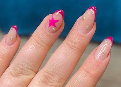 Pink and glitter star nail art at The Beauty Bar, Drumoak, Scotland, GB.