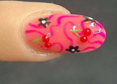 Intricate floral nail art design at The Beauty Bar, Drumoak, Scotland, GB showcasing vibrant colors and details.