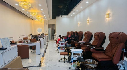 Foxie Nails Lounge in Pickerington, Ohio, US features plush pedicure chairs under elegant chandeliers.