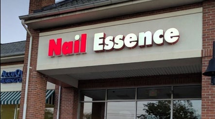Storefront of Nail Essence near Foxie Nails Lounge, Pickerington, Ohio, US, showcasing brick architecture.