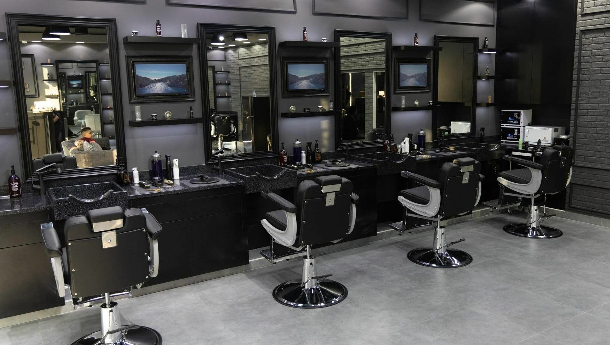 Stylish barber chairs and mirrors at Style and Shine Gents, Dubai, AE.