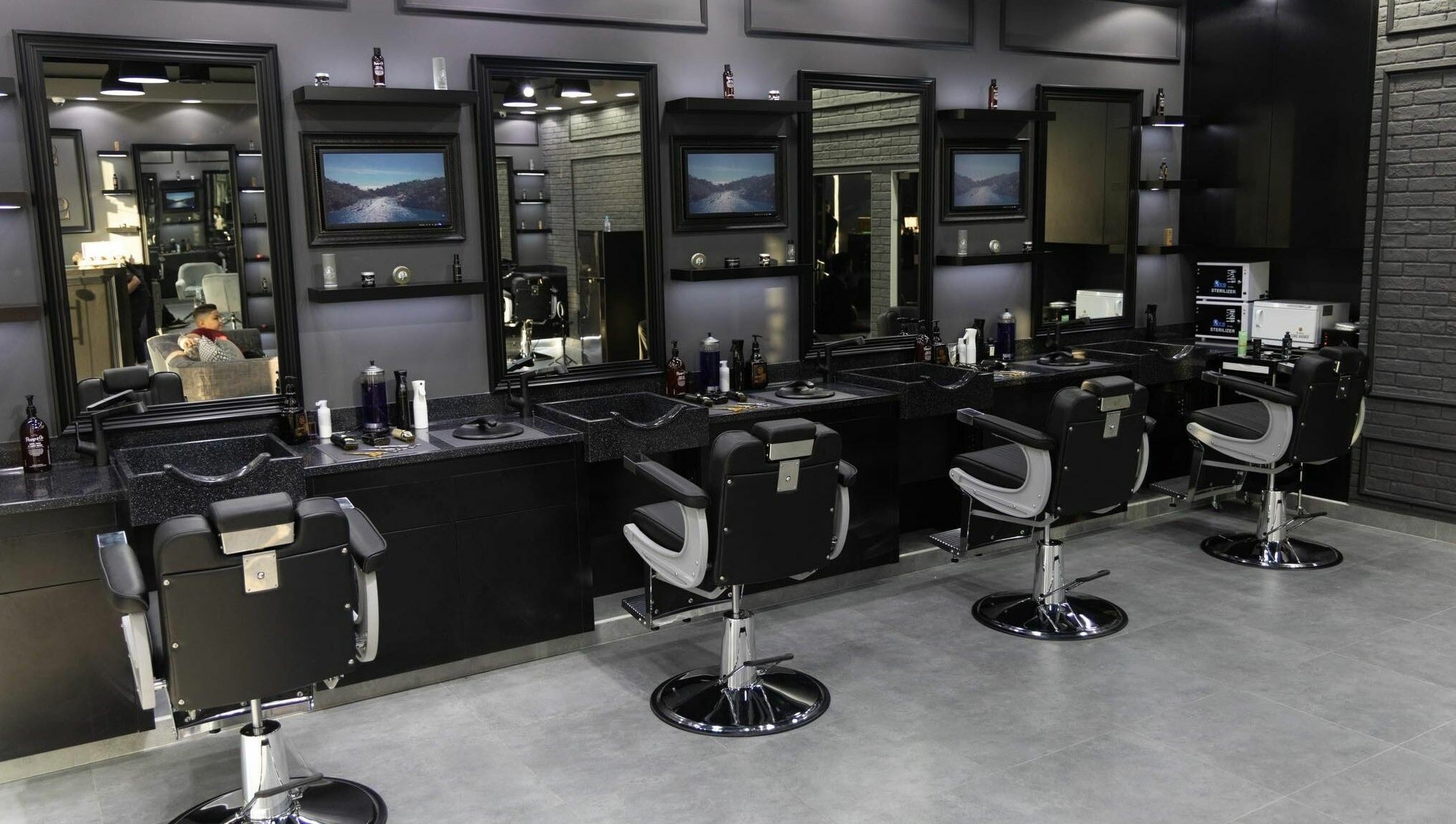 Stylish barber chairs and mirrors at Style and Shine Gents, Dubai, AE.