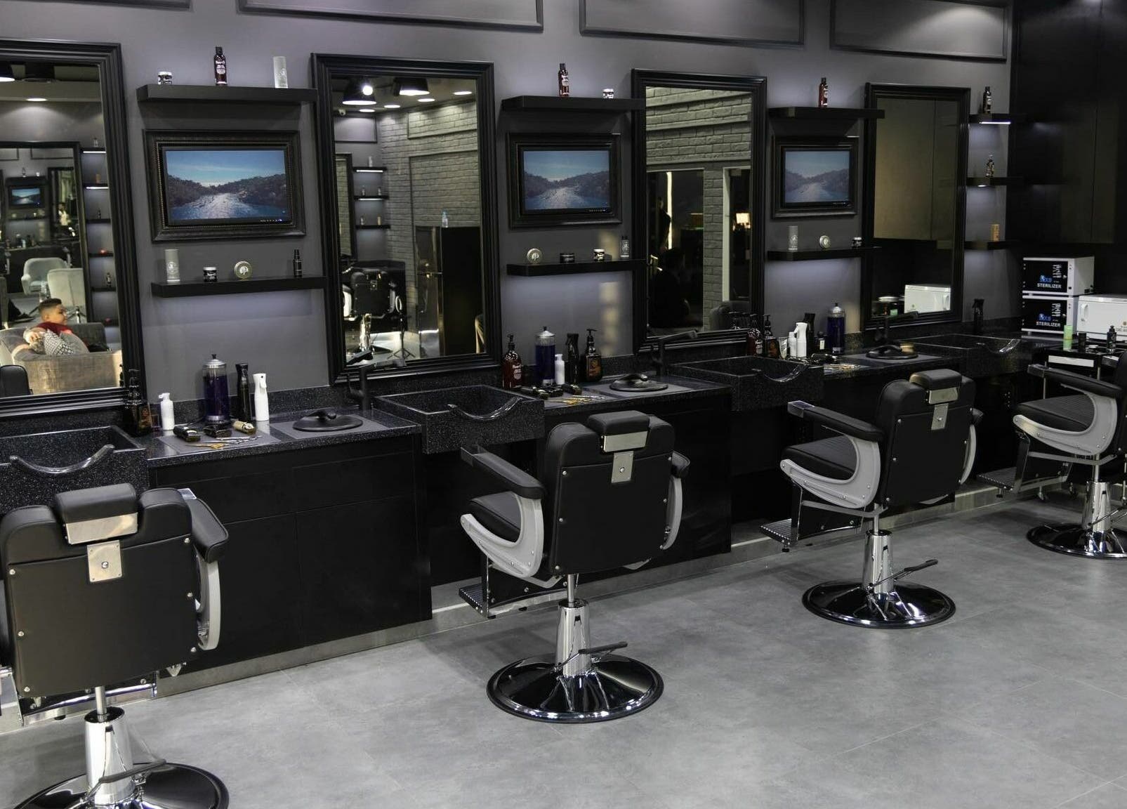 Stylish barber chairs and mirrors at Style and Shine Gents, Dubai, AE.