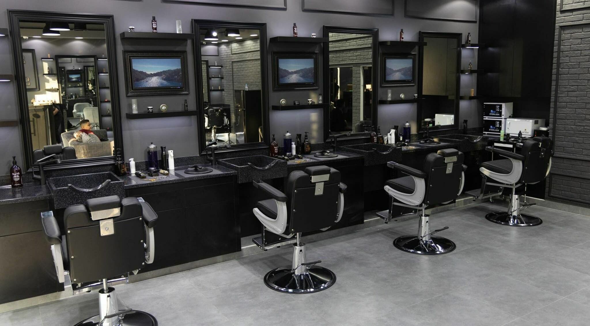 Stylish barber chairs and mirrors at Style and Shine Gents, Dubai, AE.