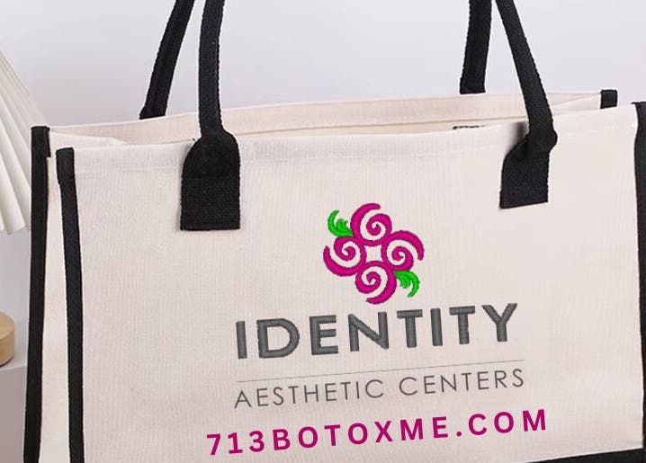 Stylish tote bag at CONROE, TX - Identity Aesthetics, Conroe, Texas, US, featuring logo and floral decor.
