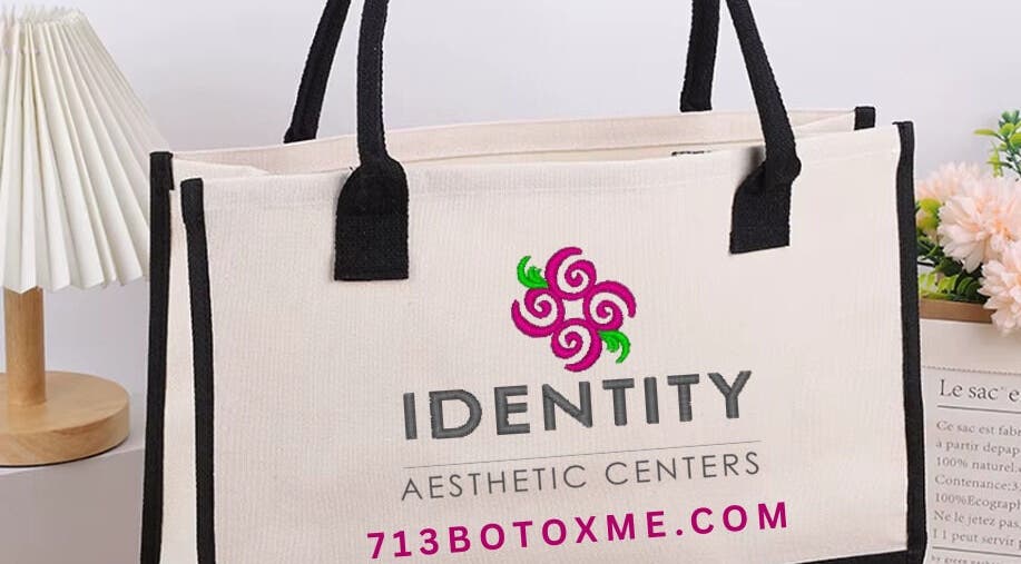 Stylish tote bag at CONROE, TX - Identity Aesthetics, Conroe, Texas, US, featuring logo and floral decor.