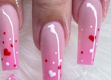 Elegant pink heart-themed nails at Angel Nails & Head Spa in Denton, Texas, US.