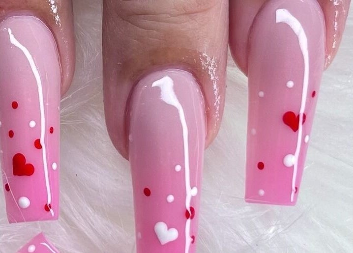 Elegant pink heart-themed nails at Angel Nails & Head Spa in Denton, Texas, US.