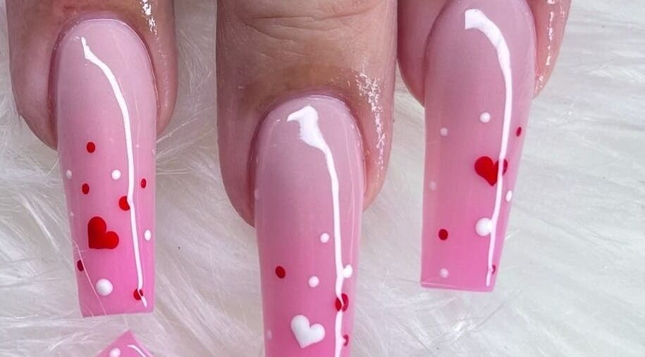 Elegant pink heart-themed nails at Angel Nails & Head Spa in Denton, Texas, US.