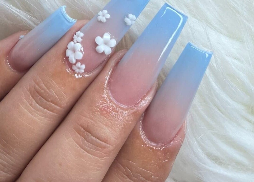 Elegant blue ombre nails with floral design at Angel Nails & Head Spa, Denton, Texas, US.