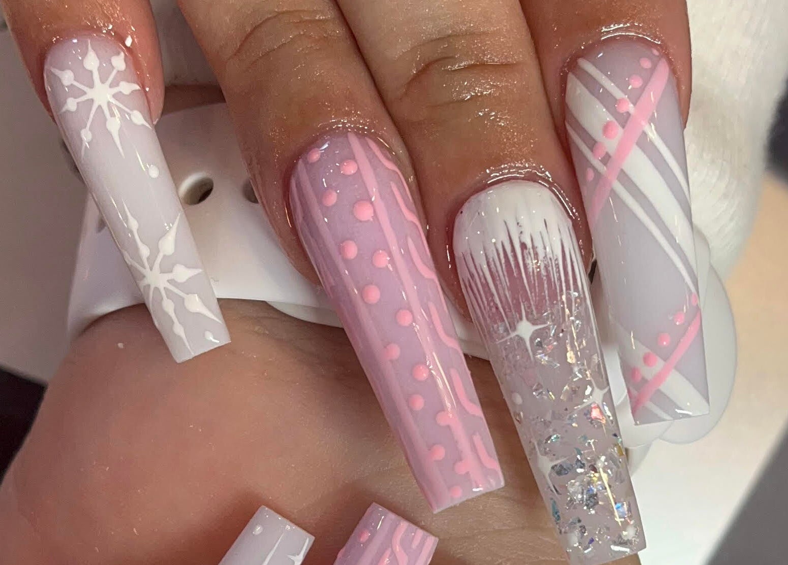 Beautifully designed nails at Angel Nails & Head Spa in Denton, Texas, US showcasing intricate art.