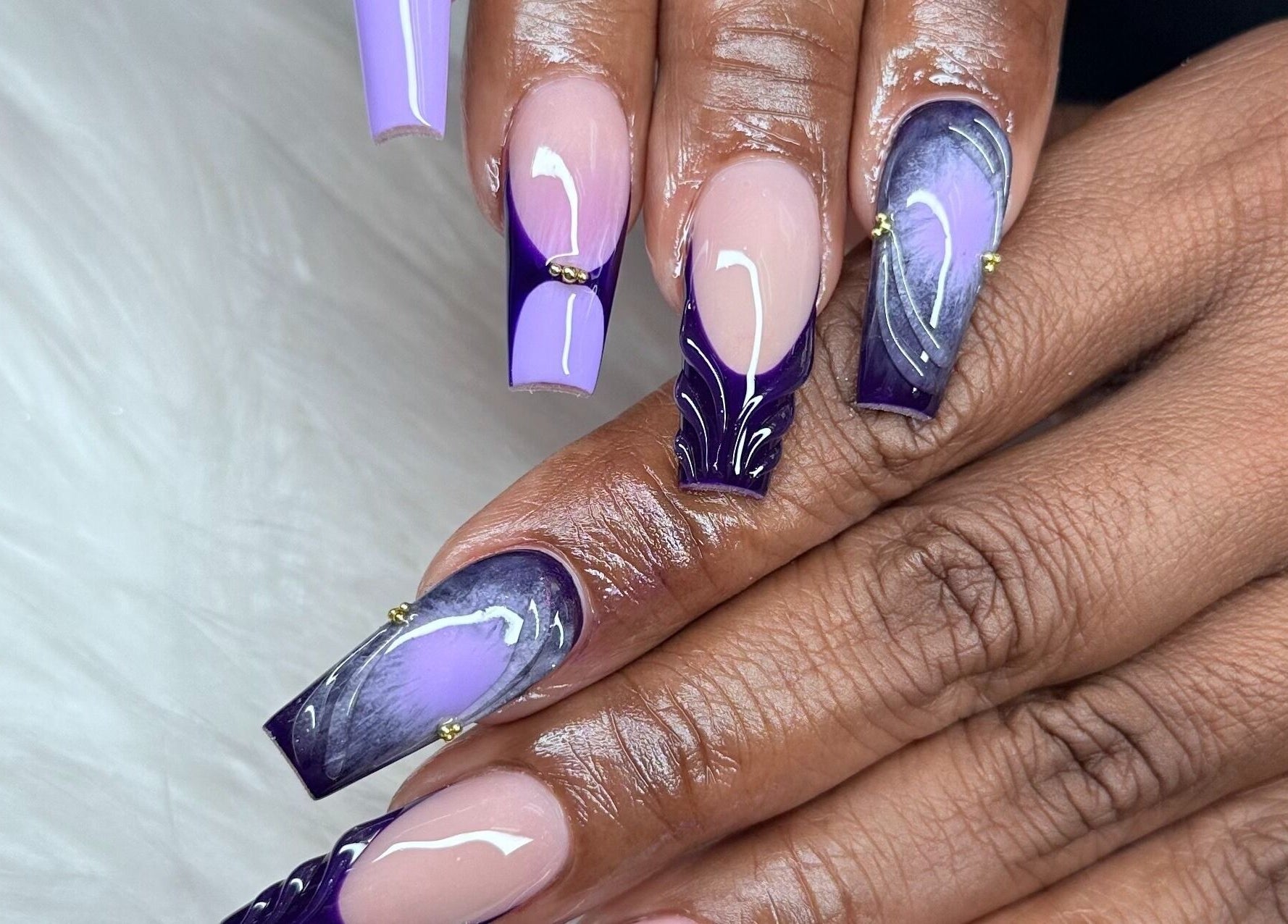 Stylish purple and nude nail art from Angel Nails & Head Spa, Denton, Texas, US.
