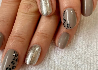 Chic nail art with metallic and leopard design at Botanical Beauty, Swadlincote, England, GB.