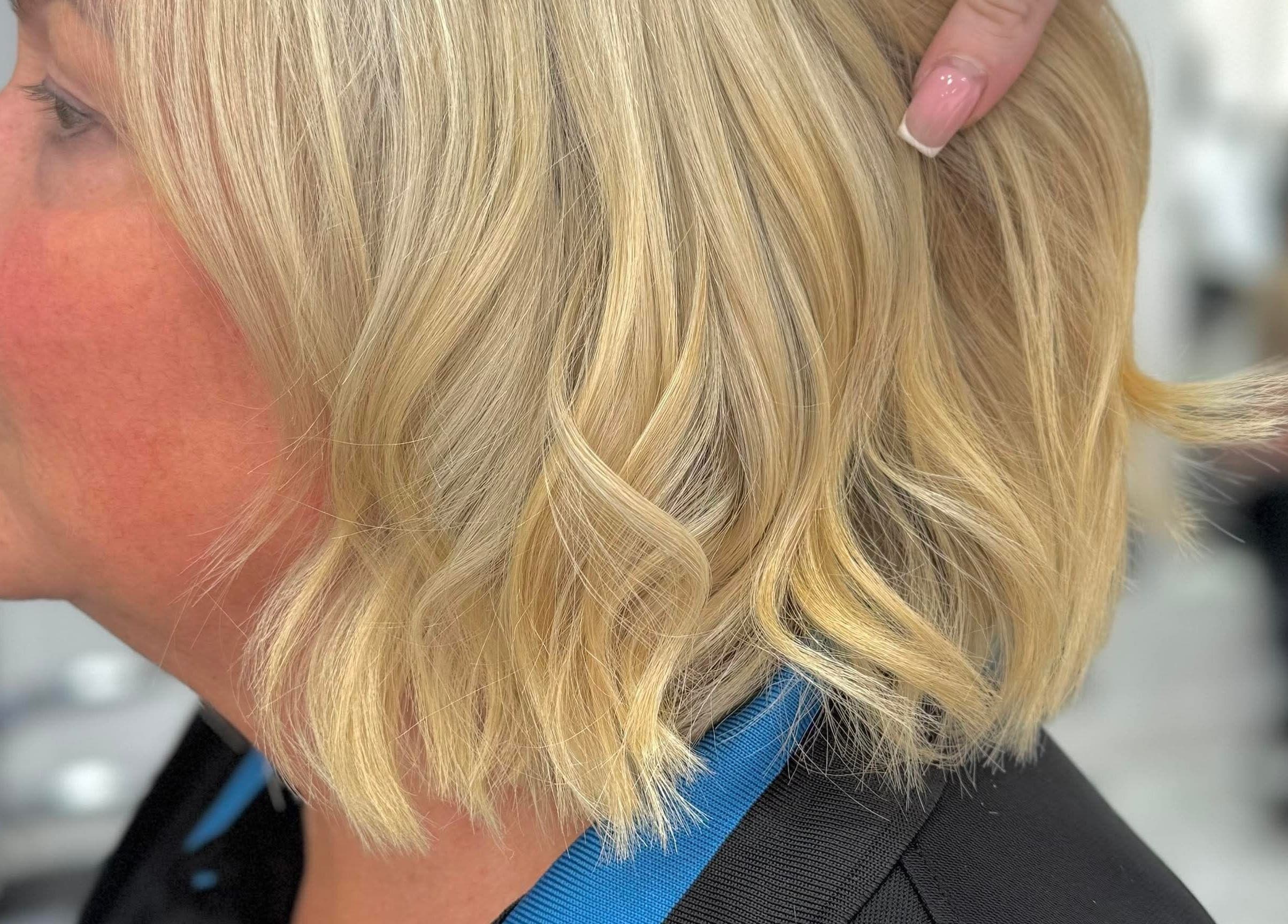 A person with stylish blonde hair at KHD, Newtongrange, Scotland, GB.