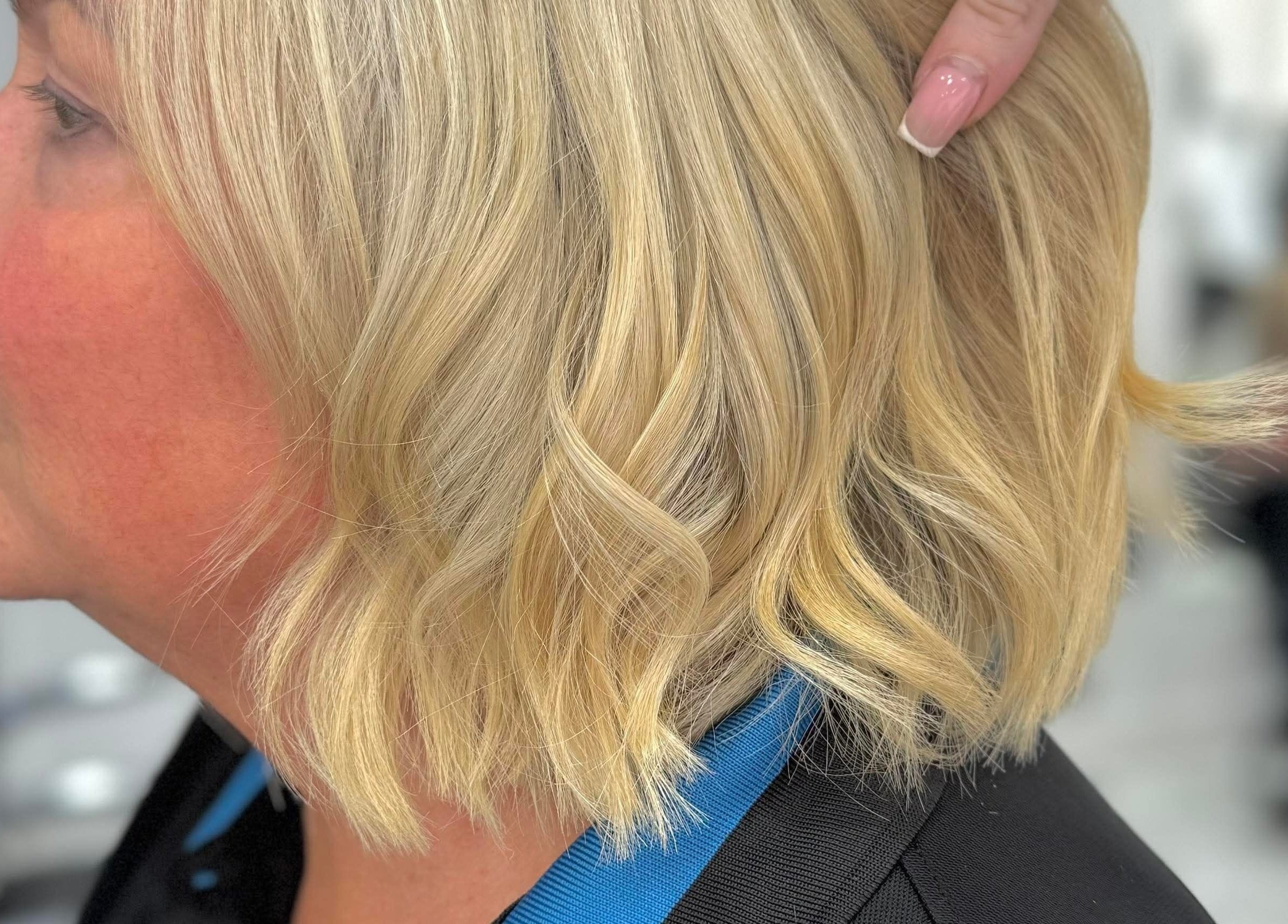 A person with stylish blonde hair at KHD, Newtongrange, Scotland, GB.