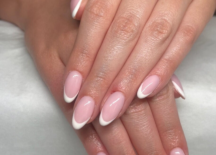 Elegant French manicure at SC Beauty in Limerick, County Limerick, IE showcasing perfect pink and white nails.