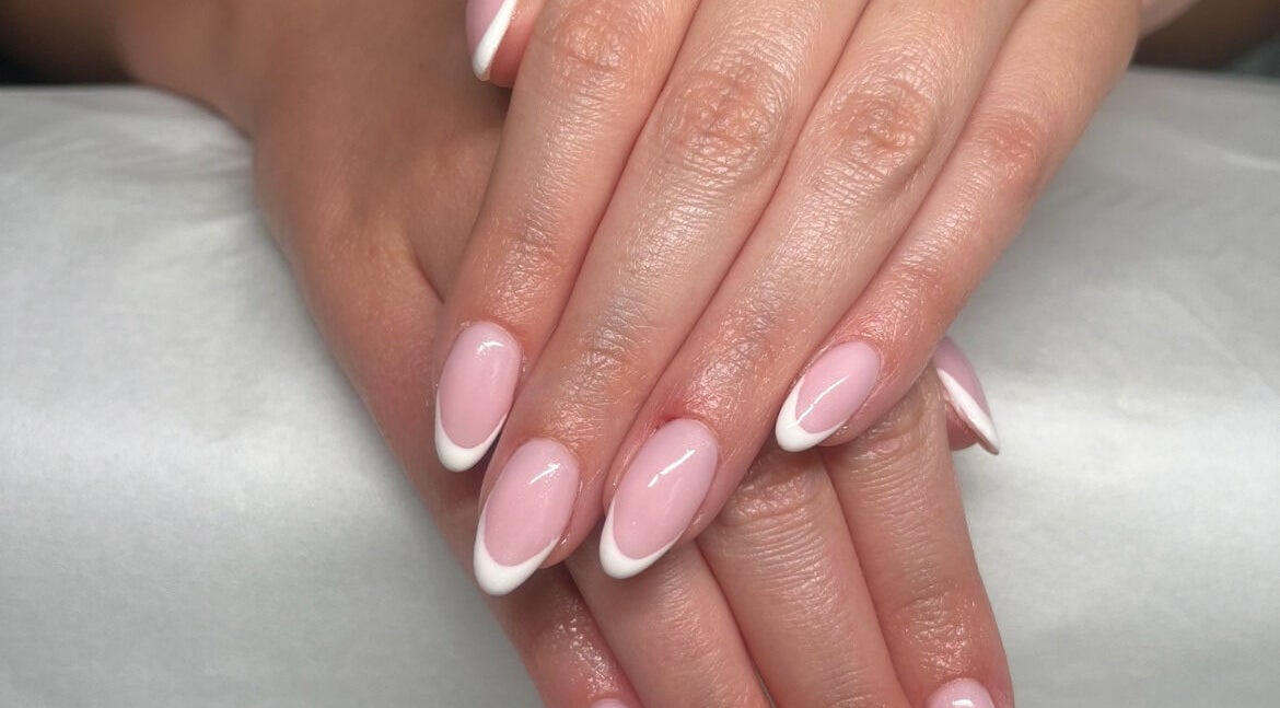 Elegant French manicure at SC Beauty in Limerick, County Limerick, IE showcasing perfect pink and white nails.