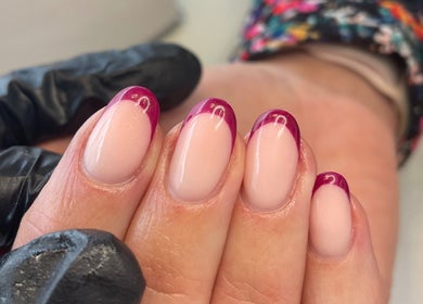Elegant French manicure with vibrant tips at The Beauty Co., Rugby, England, GB.