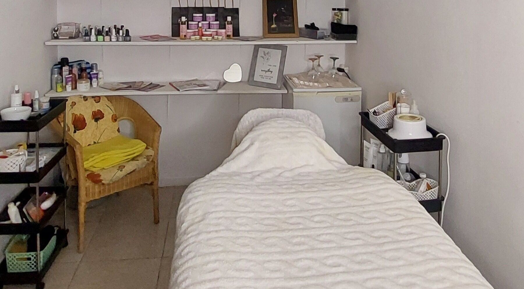 Cozy treatment room at The Massage and Beauty Room, Cape Town, Western Cape, ZA, with massage bed and supplies.