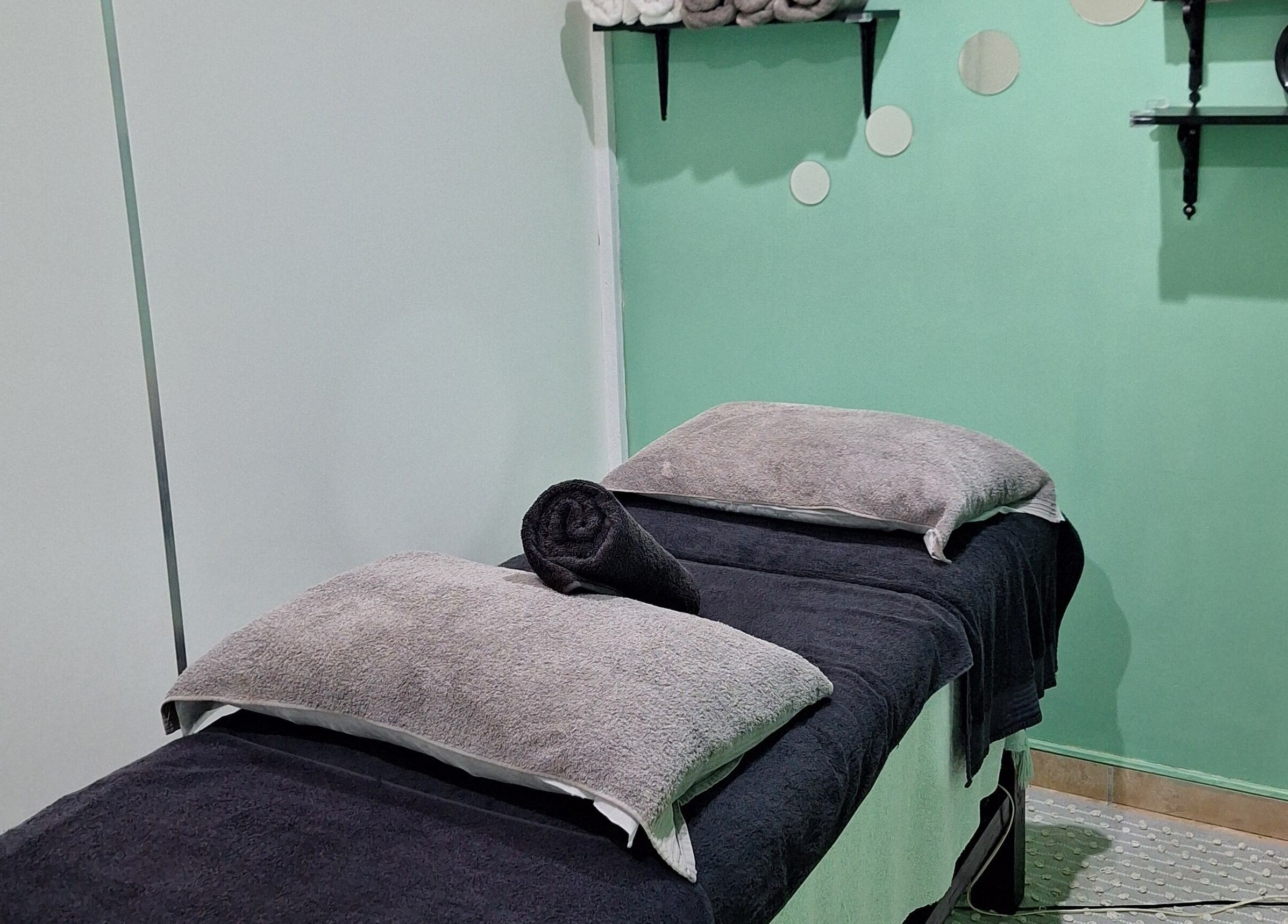Relaxing treatment room at Arukah Skin & Beauty in Paarl, Western Cape, ZA with calming decor and cozy linens.