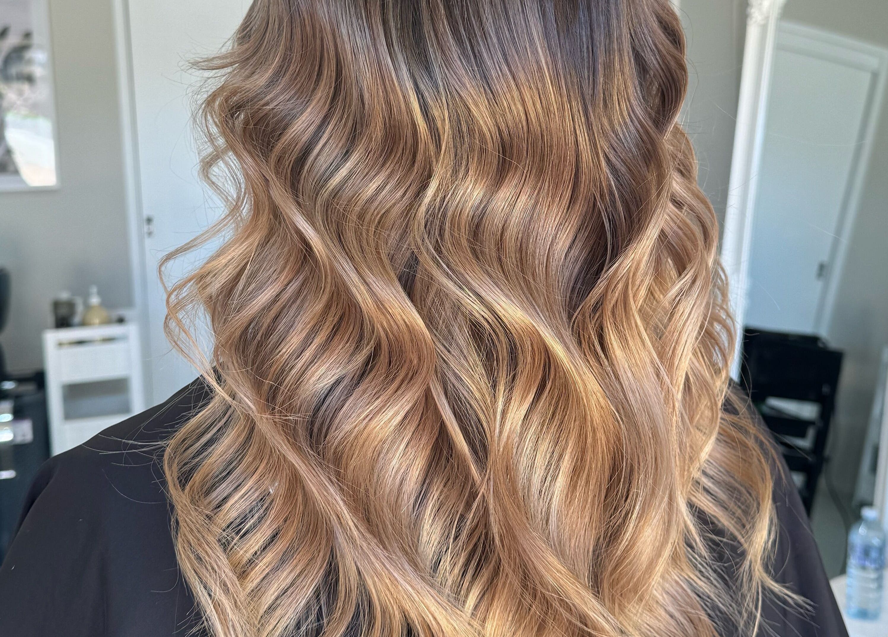 Elegant wavy hairstyle at Colour Haus by TJ, Wilton, New South Wales, AU enhancing natural beauty.