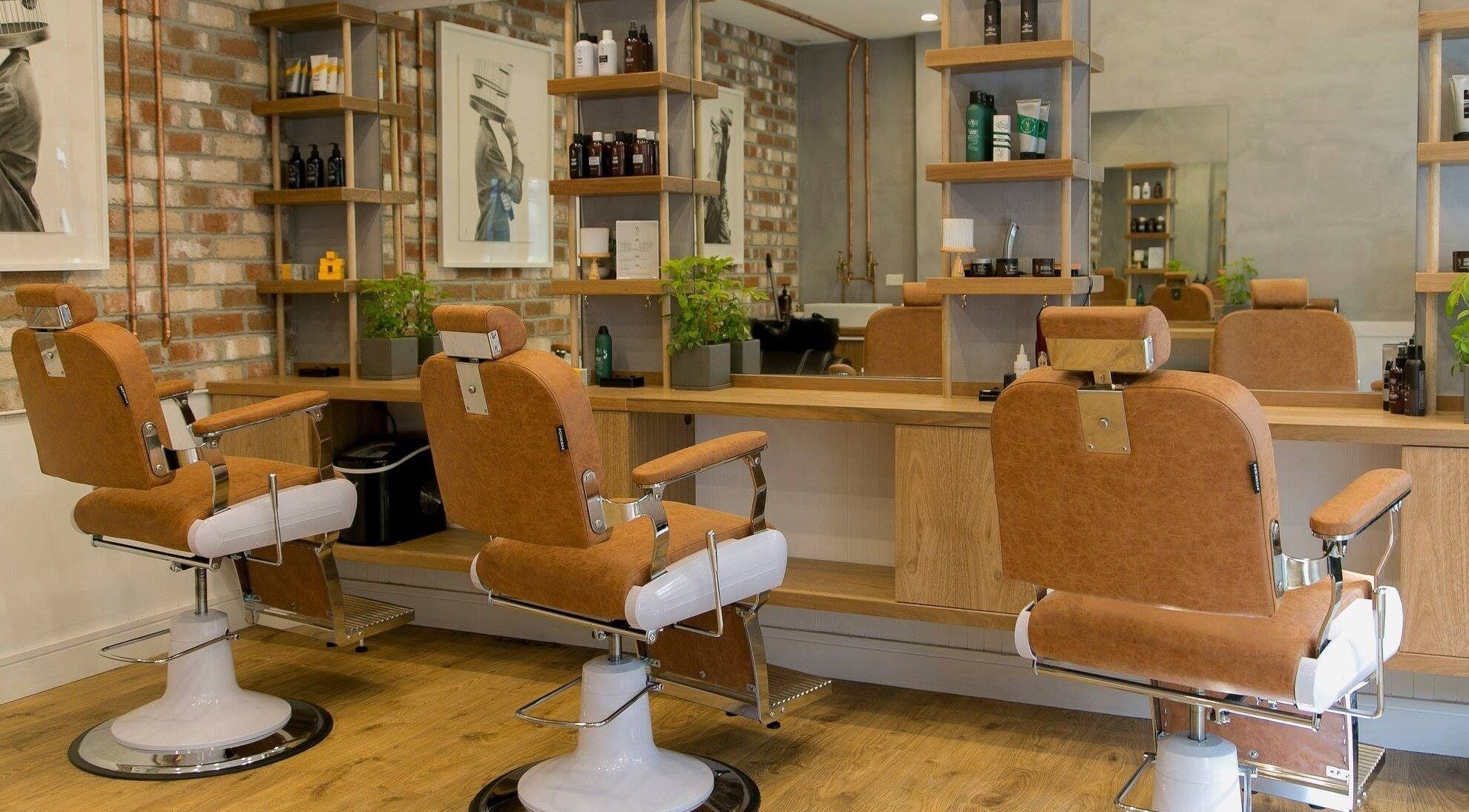 Chic interior of Adilla Barbers - Coogee, highlighting leather chairs and modern decor in Coogee, New South Wales, AU.