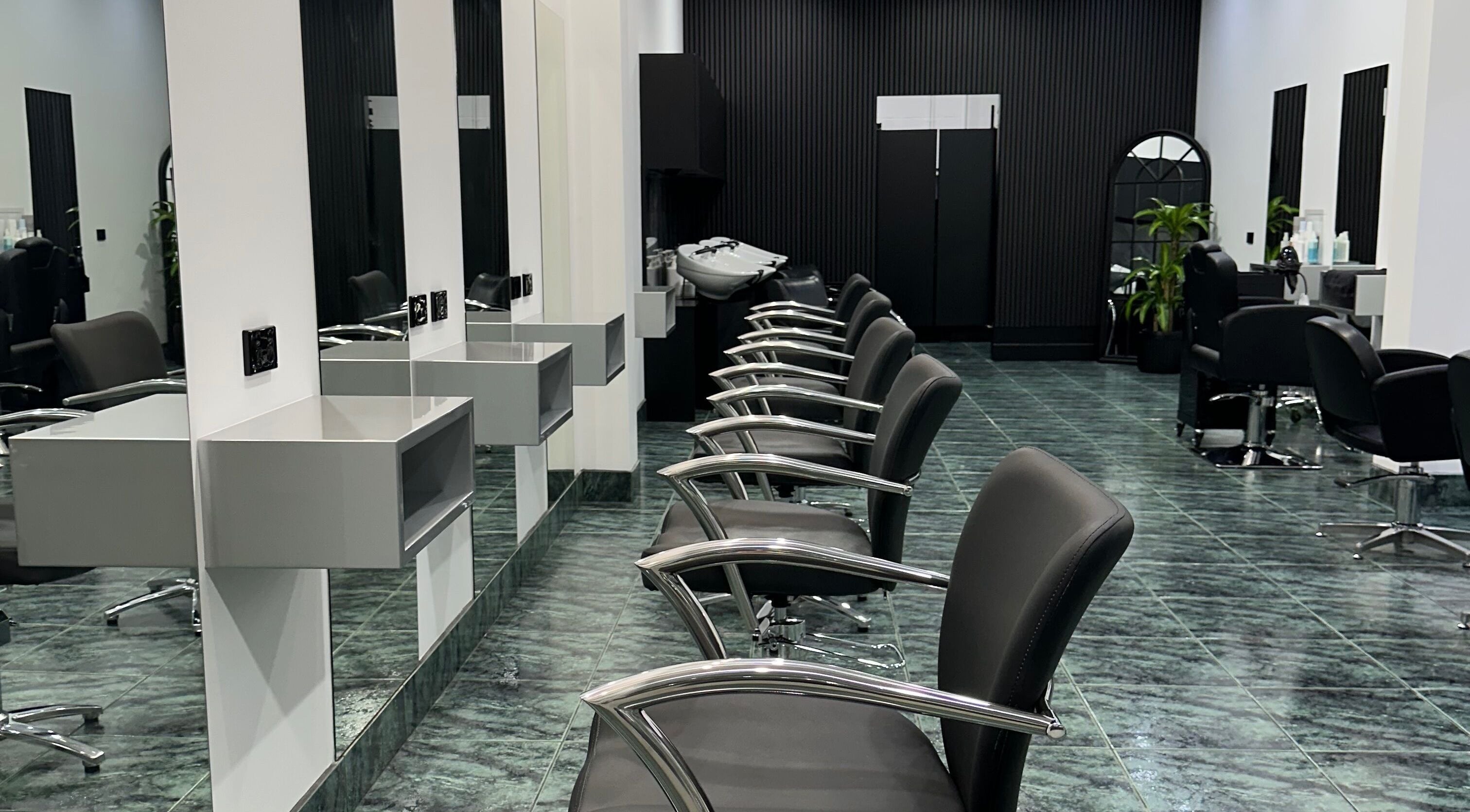 Modern salon chairs and mirrors at Dooki Hair & Co., Melbourne, Victoria, AU.