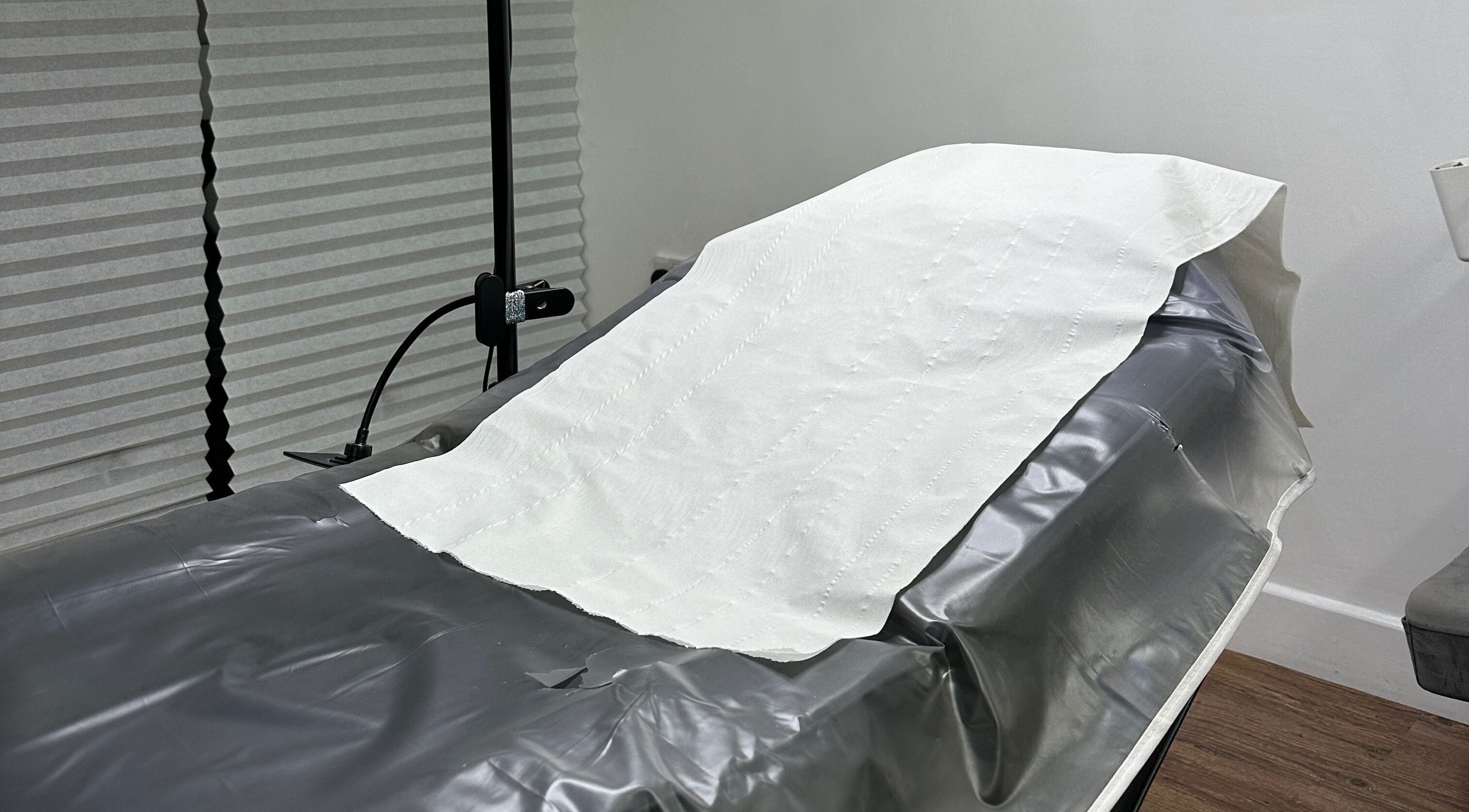 Treatment bed at Linglash & Aesthetics, London, England, GB for comfort and relaxation during beauty services.