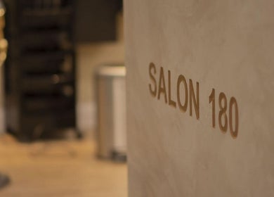 Stylish interior wall with Salon 180 sign at صالون ١٨٠ للحلاقة, Al Badi', Riyadh Province, SA.