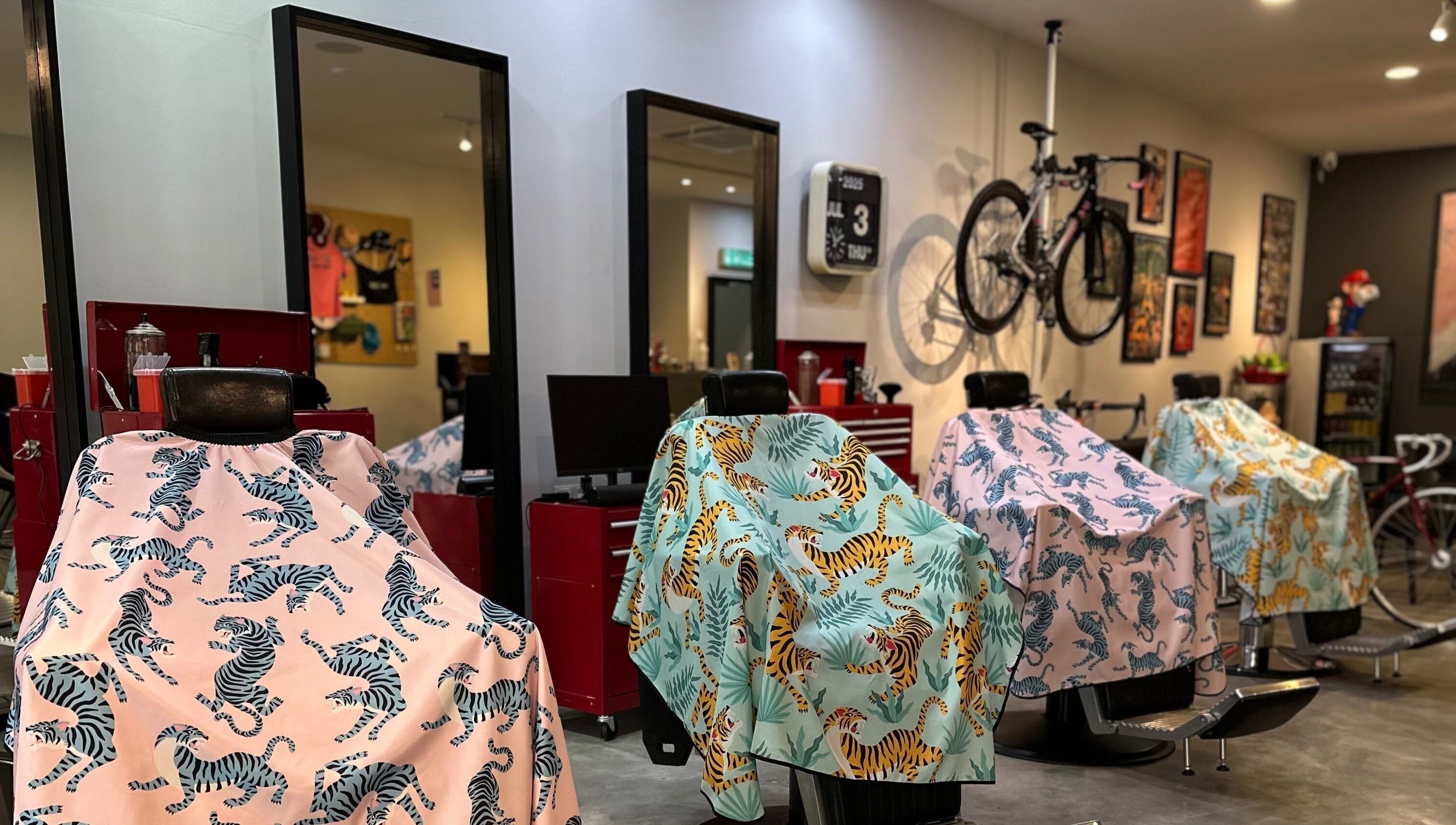 Vibrant barber chairs with animal-themed covers at Pedal Barbers, Shah Alam, Selangor, MY.