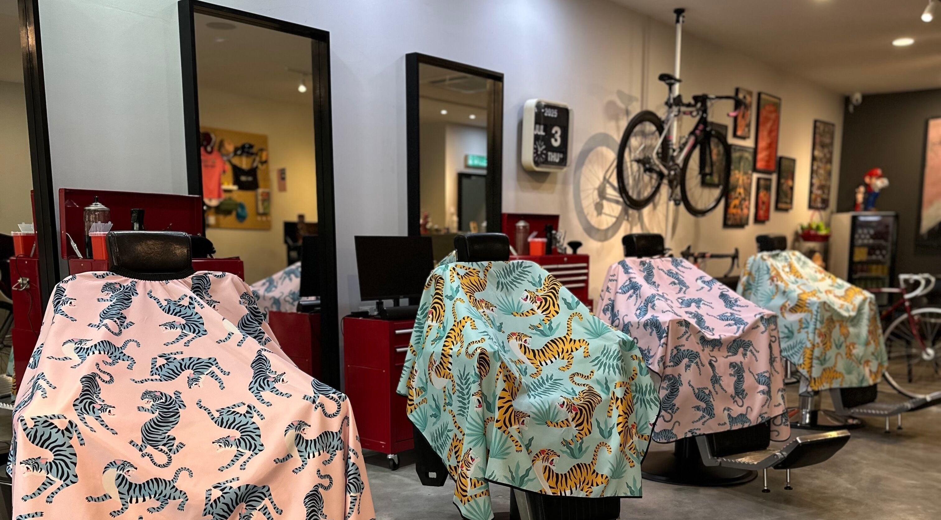 Vibrant barber chairs with animal-themed covers at Pedal Barbers, Shah Alam, Selangor, MY.