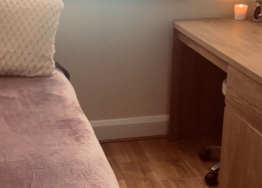 Relaxing therapy room at Kilkenny Acupuncture Clinic, Kilkenny, County Kilkenny, IE with a cozy bed and candles.