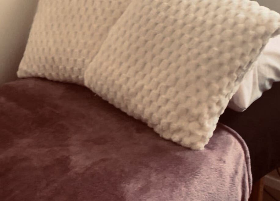 Relaxing treatment bed at Kilkenny Acupuncture Clinic, Kilkenny, County Kilkenny, IE with soft pillows.