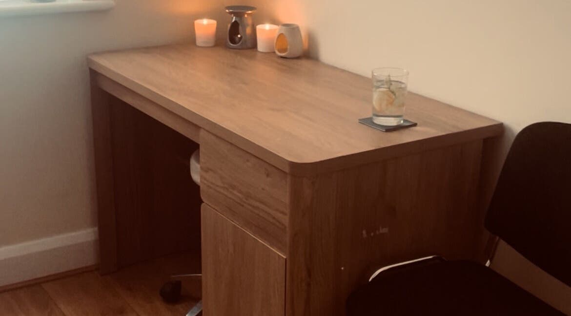 Cozy desk with candles at Kilkenny Acupuncture Clinic in Kilkenny, County Kilkenny, IE.