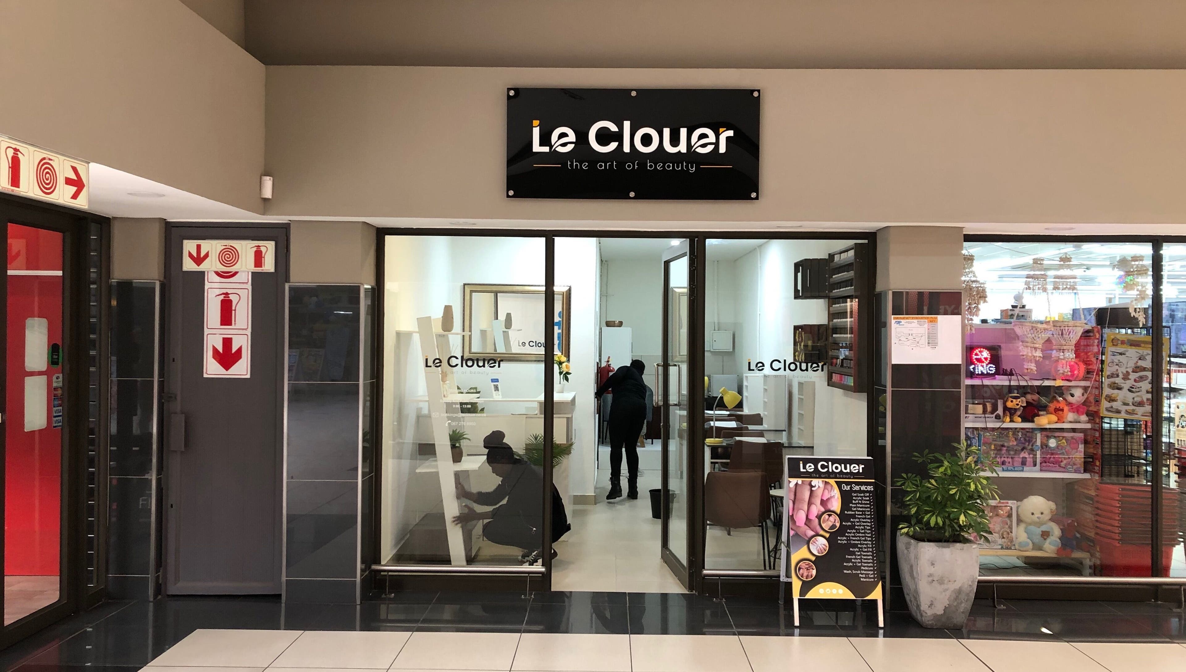 Entrance of Le Clouer beauty salon in Kempton Park, Gauteng, ZA, showcasing elegant interior design.