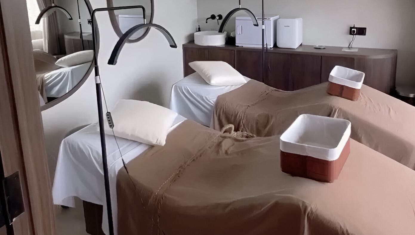 Relaxing treatment room at Saya Holistic Spa, Bali, Bali, ID with two massage beds.