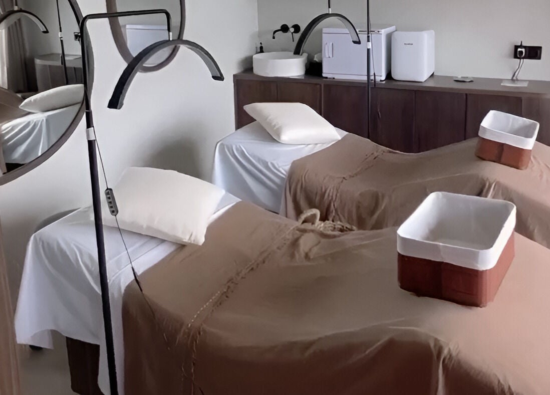 Relaxing treatment room at Saya Holistic Spa, Bali, Bali, ID with two massage beds.