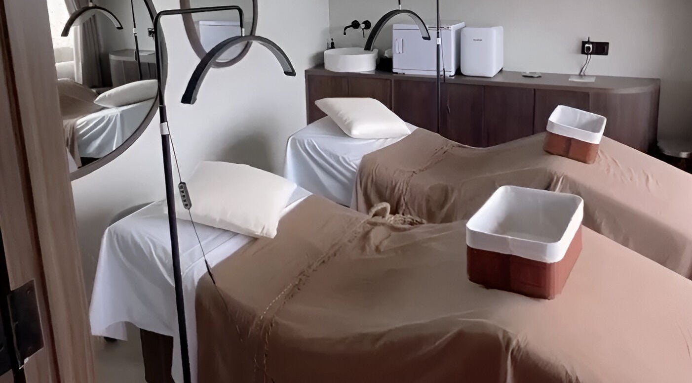 Relaxing treatment room at Saya Holistic Spa, Bali, Bali, ID with two massage beds.