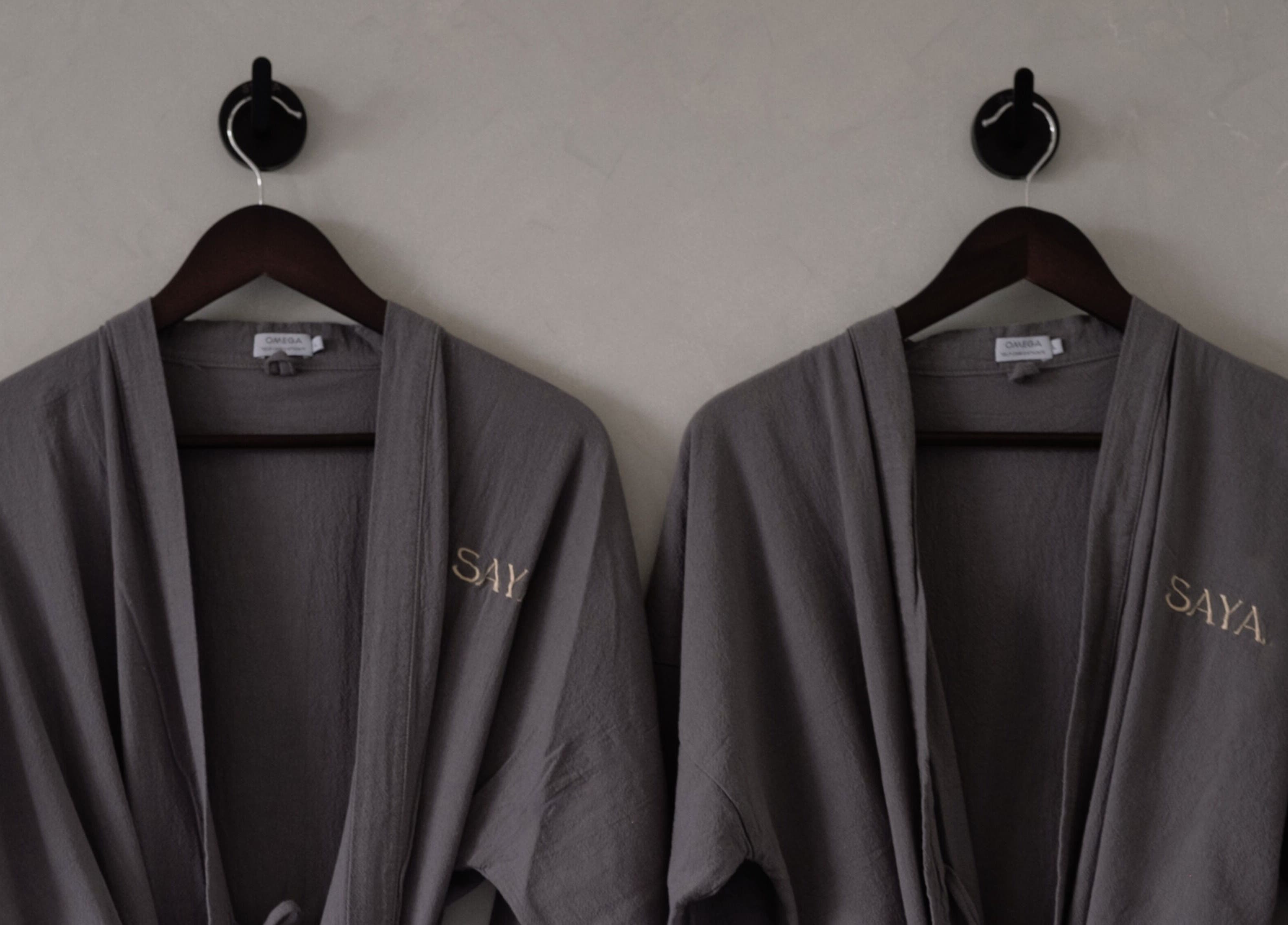 Elegant robes at Saya Holistic Spa, Bali, offering a tranquil wellness experience.