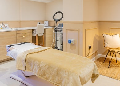 Elegant treatment room at The Skin Studio, London, England, GB with warm tones and modern design.
