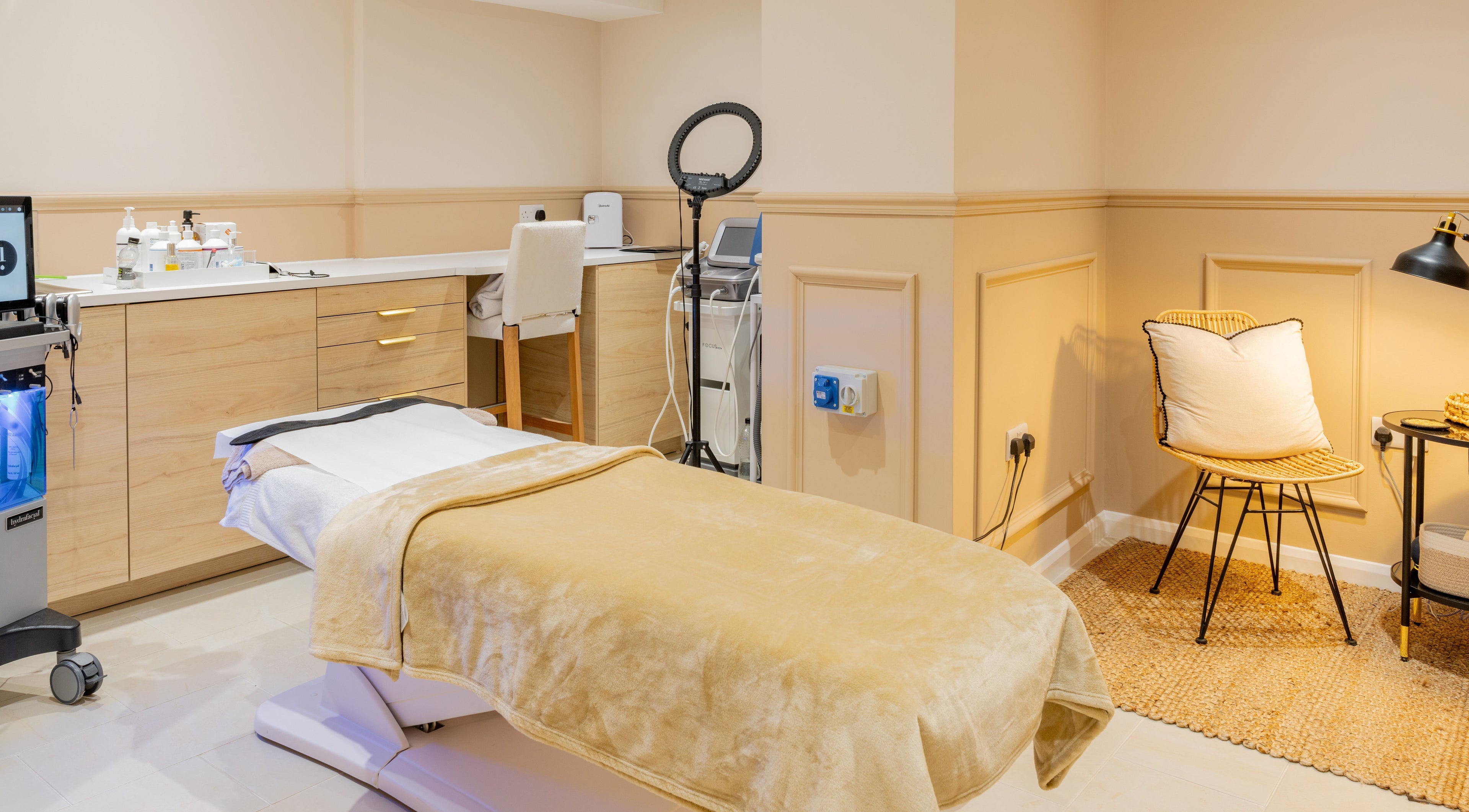 Elegant treatment room at The Skin Studio, London, England, GB with warm tones and modern design.