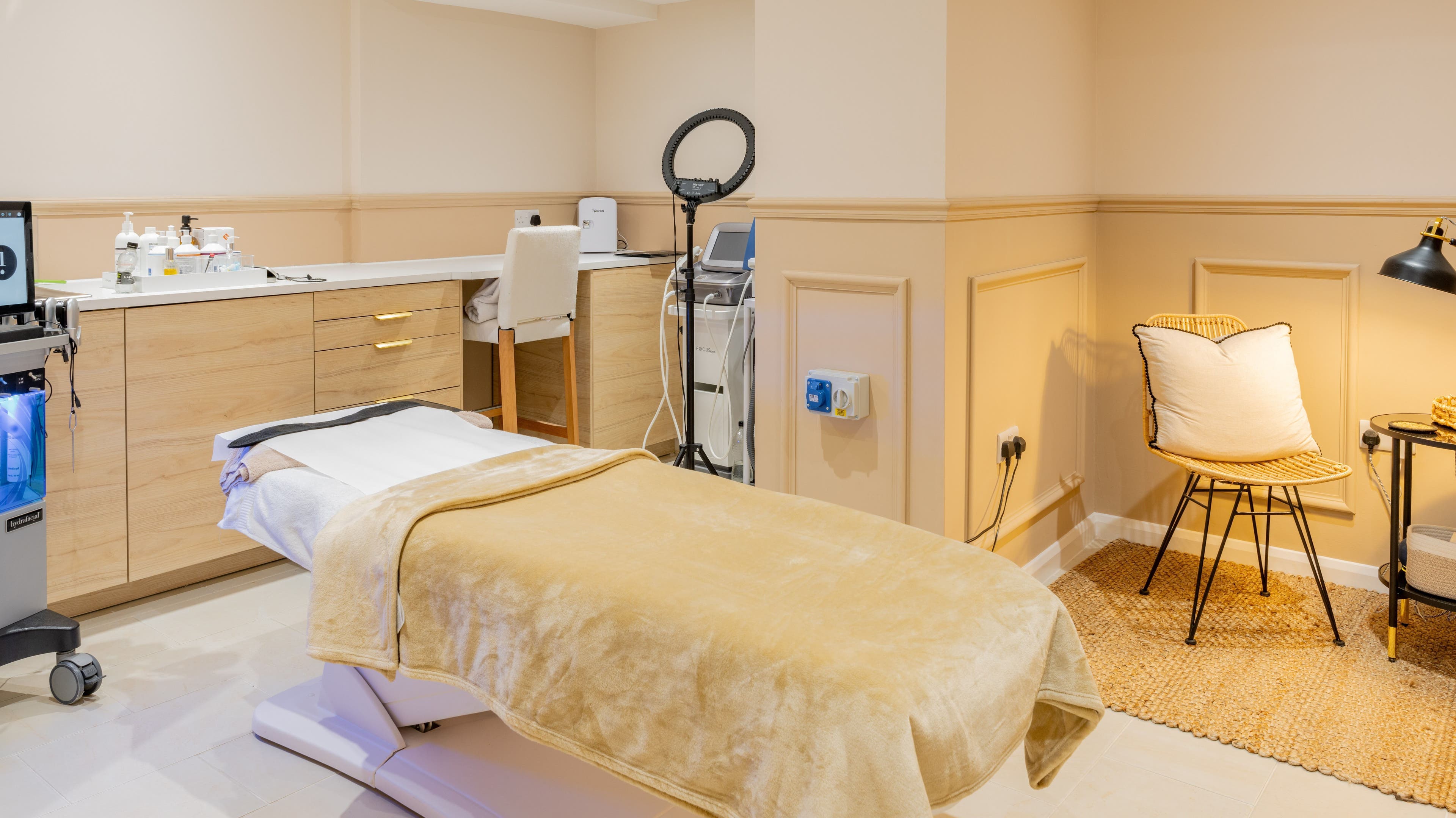 Elegant treatment room at The Skin Studio, London, England, GB with warm tones and modern design.