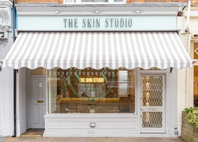 Entrance of The Skin Studio with awning in London, England, GB. Elegant exterior showcasing beauty venue.