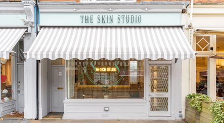 Entrance of The Skin Studio with awning in London, England, GB. Elegant exterior showcasing beauty venue.