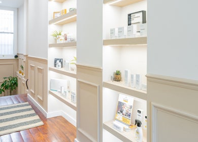 Sleek product shelves at The Skin Studio, London, England, GB showcase premium skincare items.