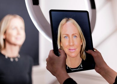 A woman’s portrait on a tablet at The Skin Studio, London, England, GB, highlighting advanced imaging technology.