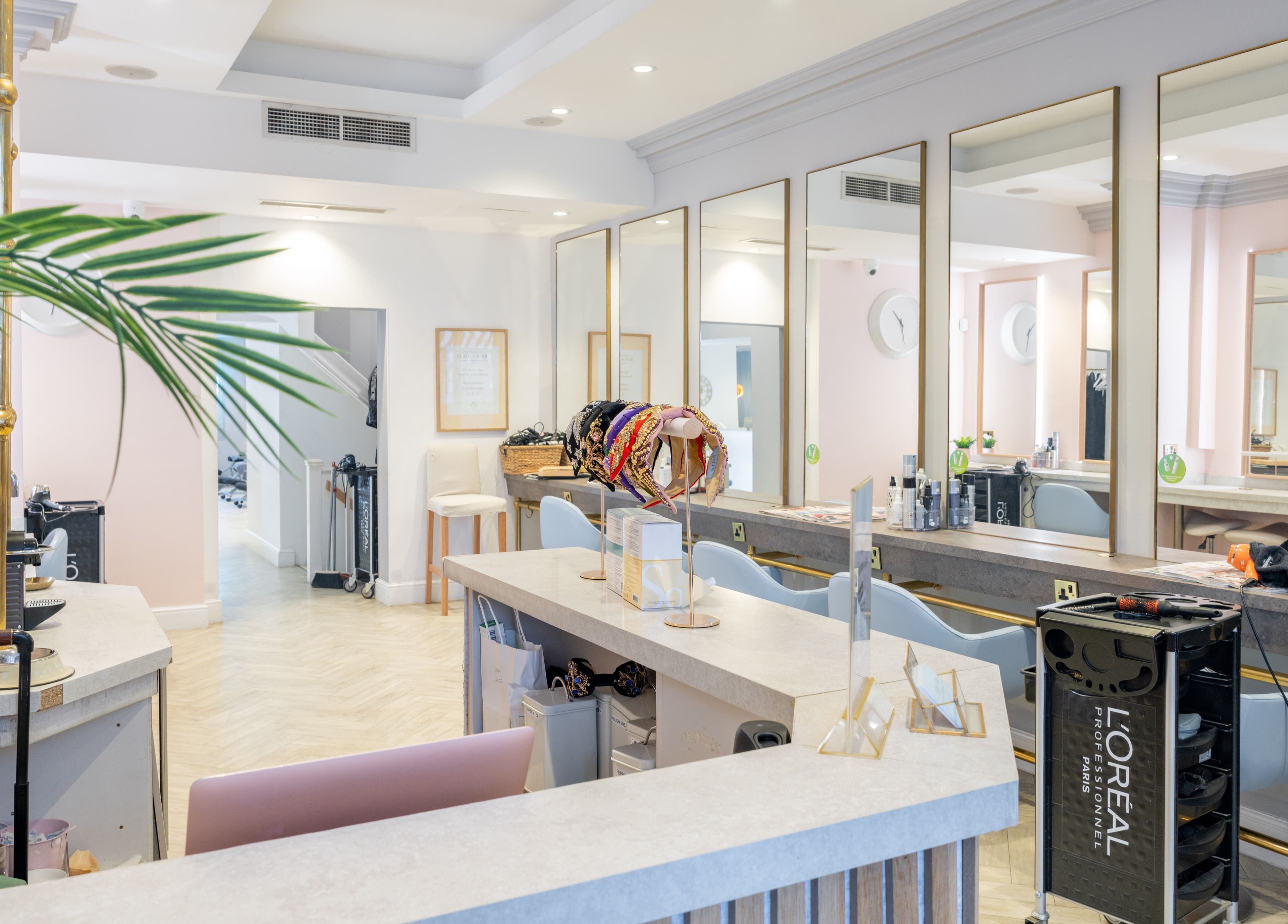 Interior of Blush + Blow London salon in London, England, GB, featuring stylish mirrors and modern decor.